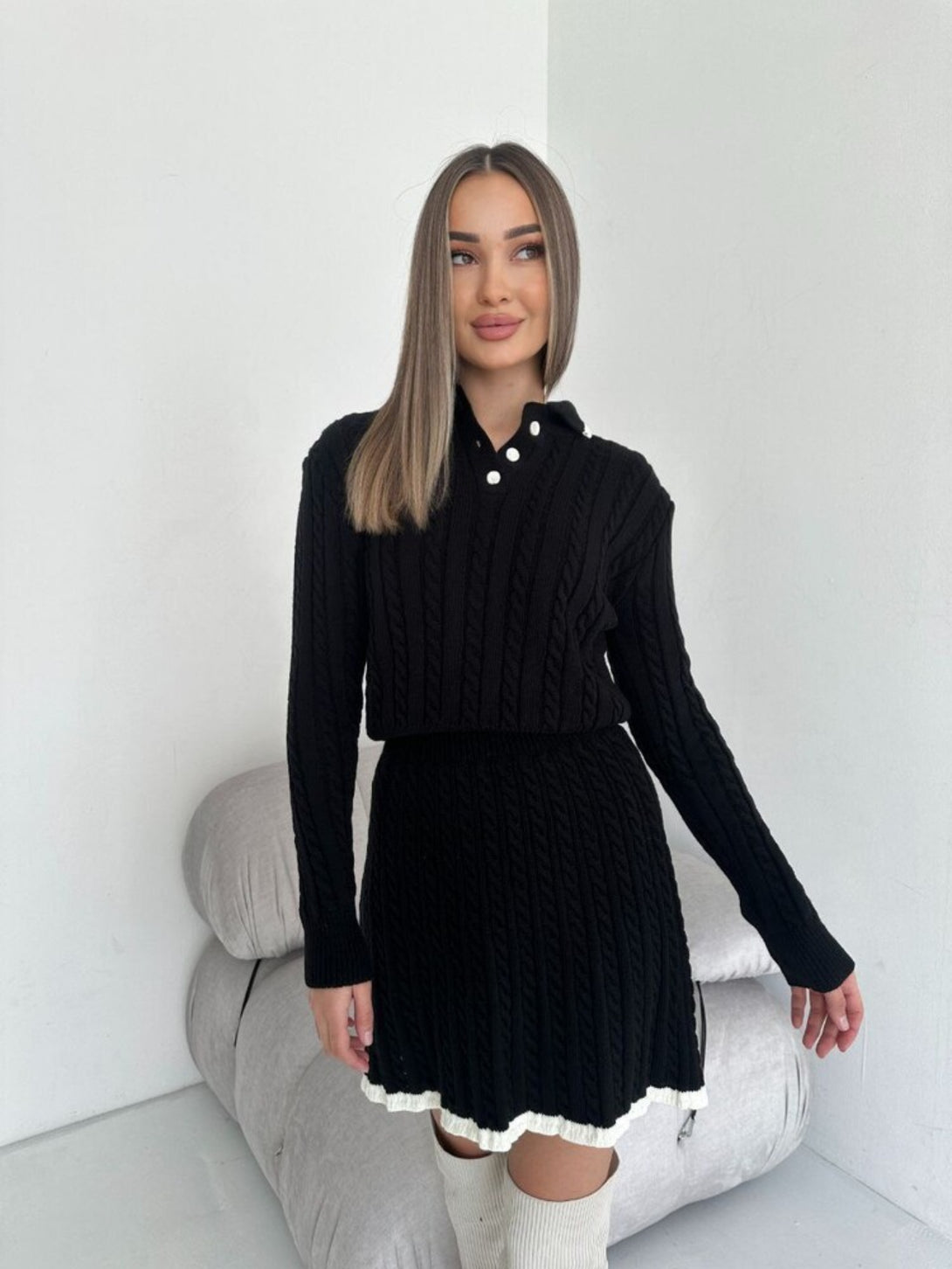 Black long sleeved short skirt sweater set