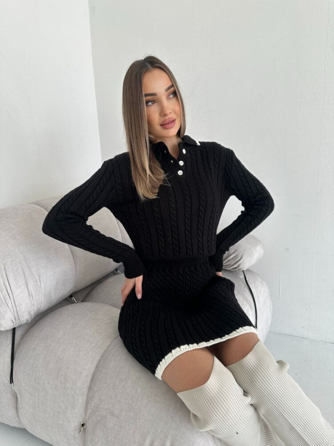 Black long sleeved short skirt sweater set